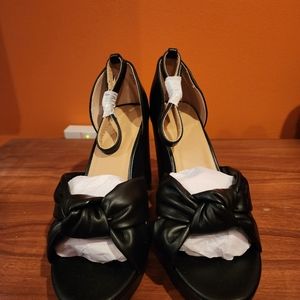 Loft black high heel shoes in size 9 with ankle straps.